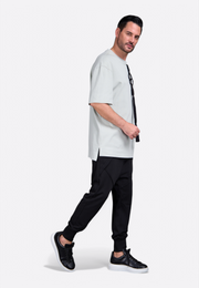 Model wearing Emirates Limited men's t-shirt with tassel by East Vibe